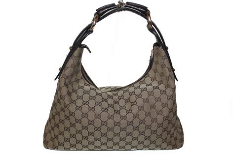 gucci made in italy vintage brown leather with round handle|Gucci leather shoulder handbags.